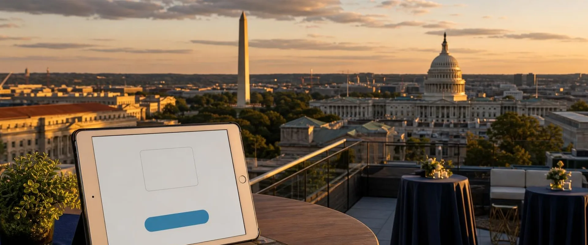 iPad check-in screen on a rooftop terrace table in Washington, D.C., with the Washington Monument and the U.S. Capitol at sunset behind it